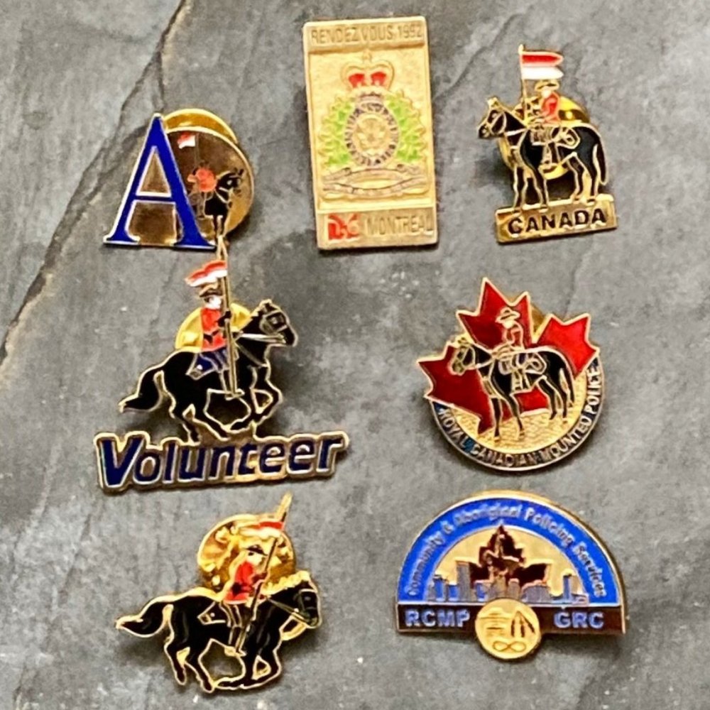 COPY - Seven different metal and enamel RCMP pins